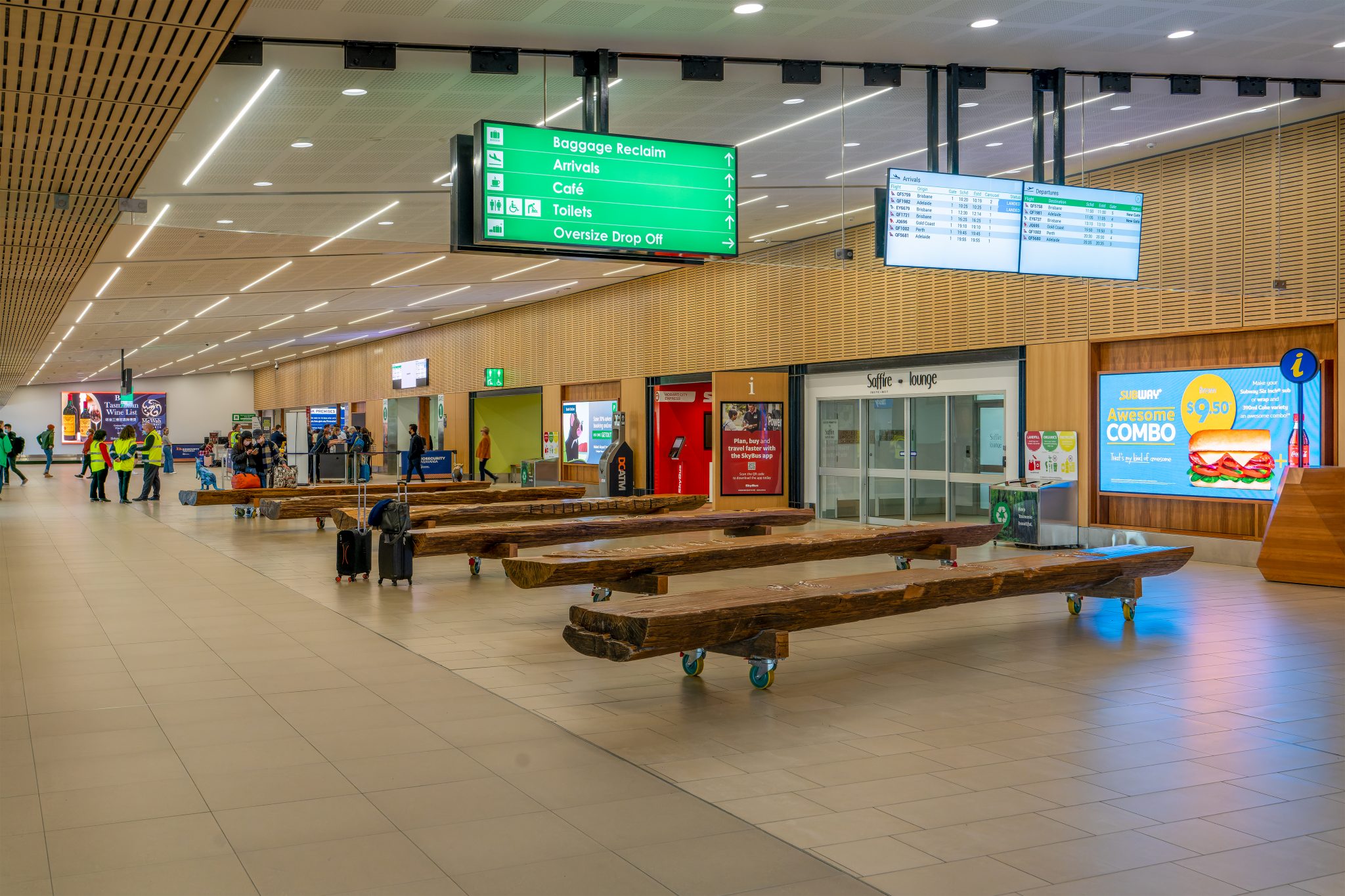 Arrivals hall with timber seating at Hobart Airport.