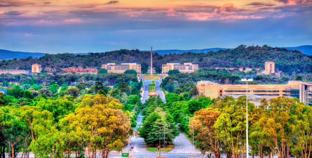 Looking towards Parliament House from the Australian War Memorial, with trees in the foreground.