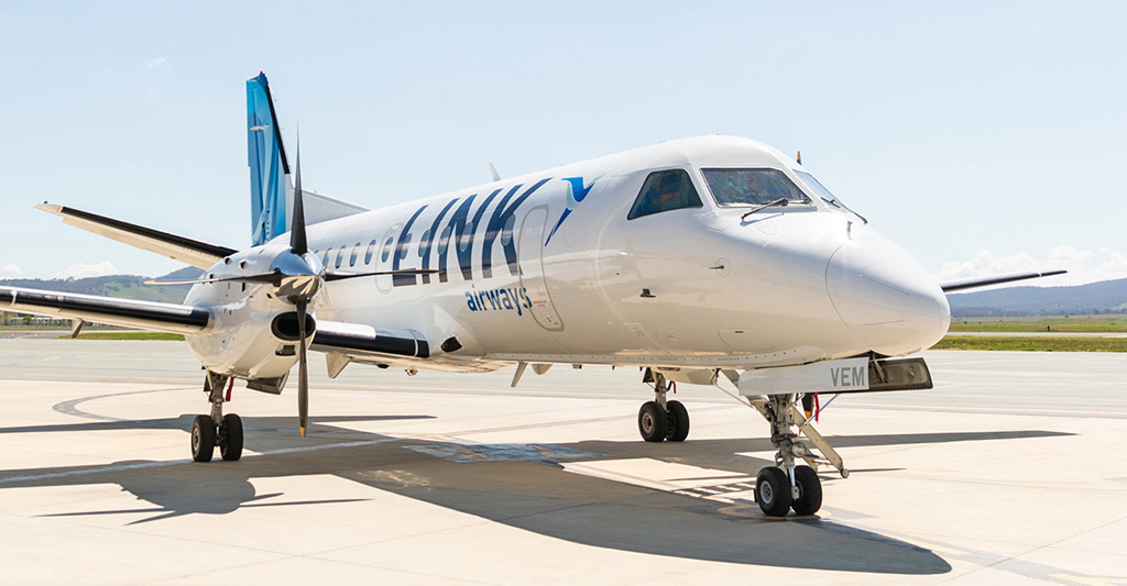 Link Airways plane parked at airport.